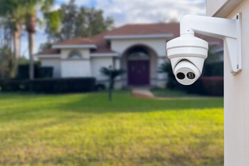 Security camera and private house on the background.