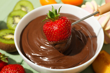 Concept of tasty sweet food - chocolate fondue