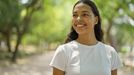 African american woman smiling confident looking to the side at park