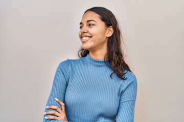 Young african american woman smiling confident standing with arms crossed gesture over isolated...