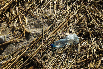 Naklejka na ściany i meble Pollution of the water body with plastic waste and garbage