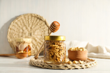 Fototapeta na wymiar Concept of tasty and sweet food - honey with nuts