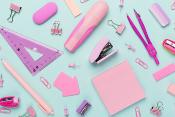Pink school stationery on color backgroung, top view