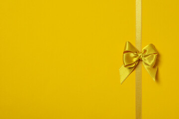 Concept of different ribbons, yellow ribbon on yellow background