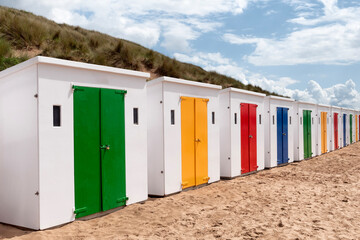 Beach huts with colourful dorors