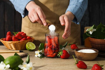 Concept of cooking tasty and sweet food - strawberry jam