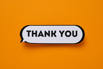 The inscription thank you in the form of a message on an orange background