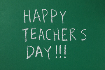 Obraz premium Happy teacher's day greetings, inscription on a green board