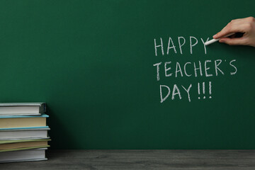 Happy teacher's day greetings, inscription on a green board