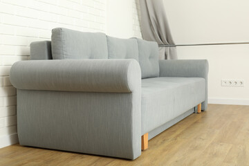 A beautiful, soft sofa in a room with white walls