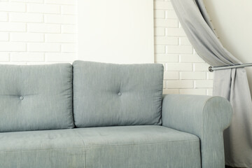 A beautiful, soft sofa in a room with white walls