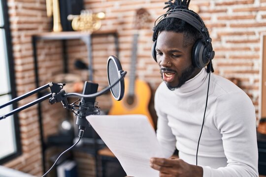 African American Woman Artist Singing Song At Music Studio