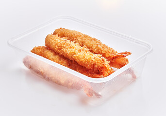  Delicious group of tempura prawns on delivery box over isolated white background