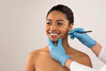 Cheerful pretty young black woman attending aesthetic clinic, copy space