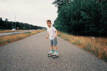 Boy 7 years old on roller skates with a surprised look