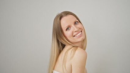Fototapeta premium Young blonde woman smiling confident standing over isolated white background