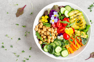Fototapeta na wymiar Vegan Buddha Bowl with Chickpeas, Avocado and Fresh Vegetables, Healthy Eating, Vegetarian Meal