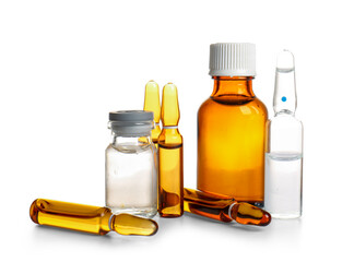 Ampules and bottles with medicines on white background