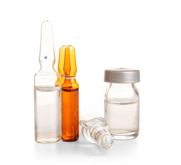 Medical ampules and bottle with medicines on white background
