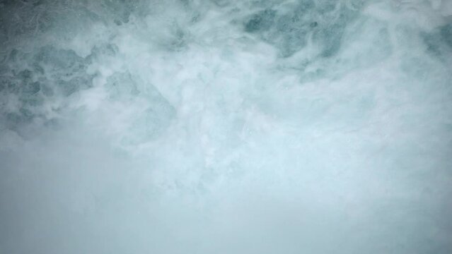 turbulent flow of pure glacial water. blue water seething after the waterfall. summer travel. hiking in Montenegro.