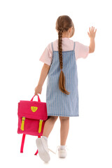 Little schoolgirl with backpack waving hand on white background, back view