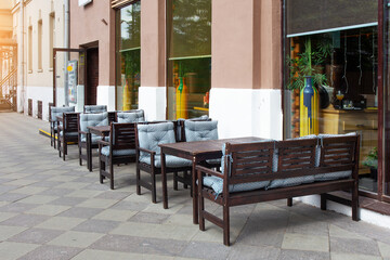 Tables and chairs in outdoor empty cafe in Moscow, Russia