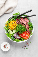 Beef steak and Fresh Vegetables Buddha Bowl, Healthy Balanced Meal on Bright Background