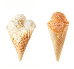 Vanilla and peach ice cream scoops in cones isolated on white background