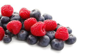 Ripe raspberry and blueberry on white background, closeup