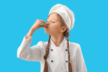 Little chef gesturing on blue background