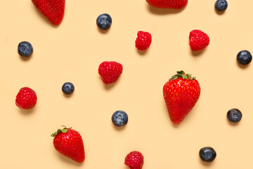 Fototapeta na wymiar Different fresh berries on orange background