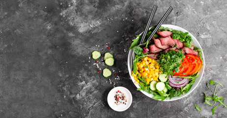Beef steak and Fresh Vegetables Buddha Bowl, Healthy Balanced Meal on Dark Background