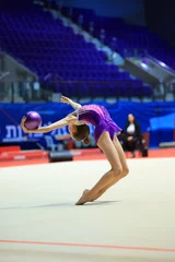 Rolgordijnen girl gymnast performs an exercise with a ball © pavlovski