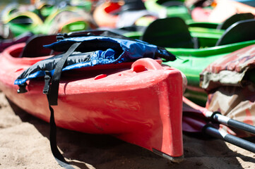 multi-colored canoes on the sand 