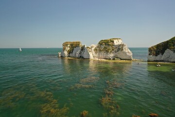 Take in breathtaking Aerial Drone views of the Jurassic coast and unique rock formations on this Old Harry Rocks geological limestone formation