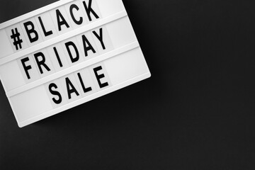 Flat lay top view promotion composition with Black friday sale text on lightbox