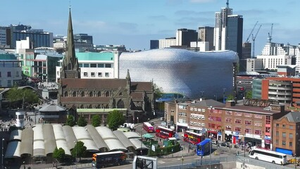 View of the skyline of Birmingham, UK including The church of St Martin, the Bullring shopping centre and the outdoor market.