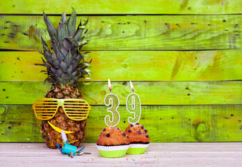 Creative card postcard happy birthday with number  39. Background character pineapple in festive...