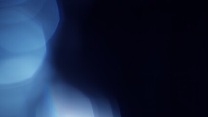 Abstract dark blue bokeh illustration background and effect overlay. Soft toned vibrant defocused decor template copy space backplate. Macro close-up glow effect product showcase backdrop. © remotevfx