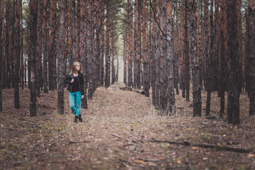 Fototapeta premium Photo of a beautiful girl, located in the forest