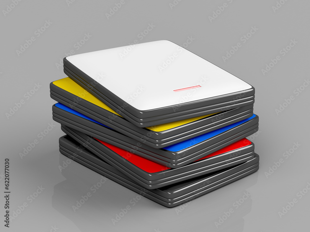 Poster stack with portable hard drives with different colors on shiny gray background