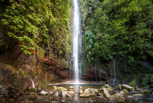 Big waterfall in the final point of popular hiking route levada 25 fontes. Rabacal, Madeira island, Portugal.