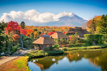 Fototapeta na wymiar Oshino, Japan historic thatch roof farmhouses with Mt. Fuji.