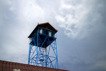 Plastic tanks for water storage installed on the high above the building. to use as a backup of water in an emergency when the water does not flow