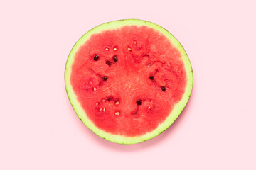 Slice of fresh watermelon on pink background