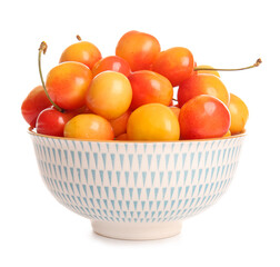 Bowl with sweet yellow cherries on white background