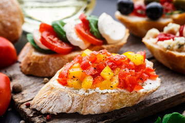 Italian bruschetta with chopped tomatoes, herbs and oil on toasted crusty ciabatta bread