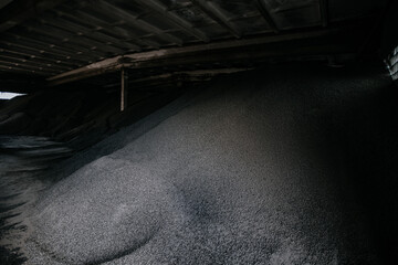 Black bio fuel pellets in warehouse