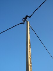 concrete electricity pole and cables