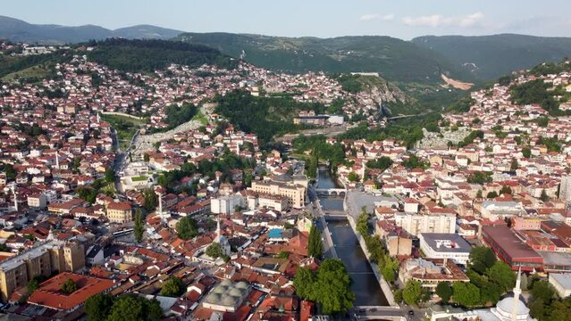 Sarajevo, Bosnia and Herzegovina: Aerial drone view of old city. Buildings, streets, houses and bridges ove the river Miljacka. 